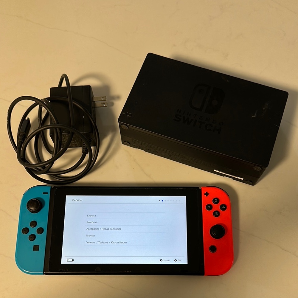 Nintendo Switch Handheld Console Blue and Red Joy-Con and charger
